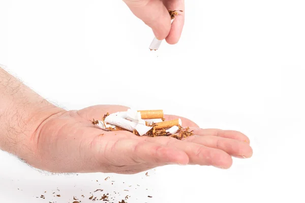 Lidská Ruka Muž Jejích Vlasech Rozbije Cigarety Nalije Druhé Dlaně — Stock fotografie