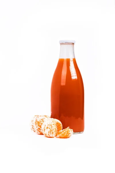 White Background Glass Bottle Orange Liquid Juice Tangerine Carrots Well — Fotografia de Stock
