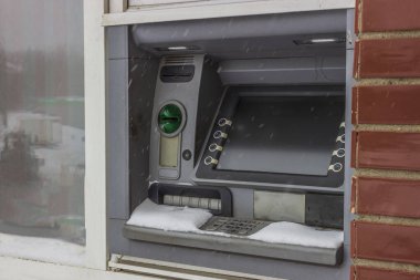 street lighting. the ATM is abandoned by snow. there is a shortage of money, payment transactions have been stopped, missing. the collapse of the banking system. there are no banknotes. inflation, deficit.
