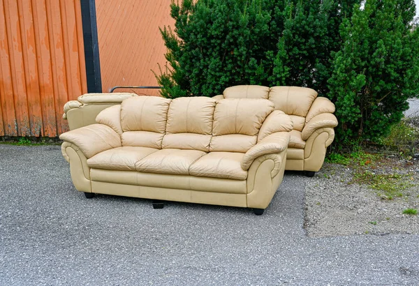 three parts of a lounge sofa standing outdoors