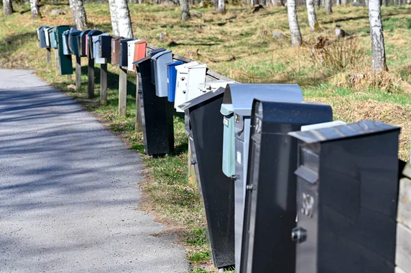 Row of mail boxes near tarmac road — Foto de Stock