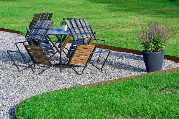 garden furniture with one table and four chairs on gravel