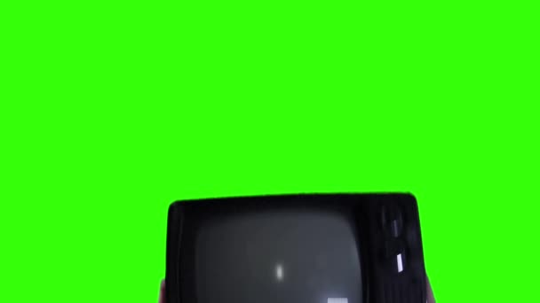 Hands Lifting Old Television Clenched Fist Its Screen Green Screen — стоковое видео