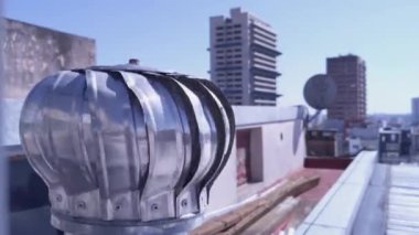Air Spinning Turbine Ventilator for Heat Control of Residential Building in Buenos Aires, Argentina. Close-Up. 4K Resolution.