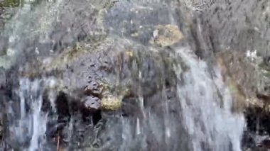 Flowing Water on a Small Cascade at the Buenos Aires Japanese Garden (Jardin Japones), Public Garden in Buenos Aires, Argentina. Close-Up. 4K Resolution.