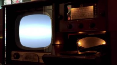 Vintage Television Set Turning On Green Screen with Static Noise. Close Up. You can replace green screen with the footage or picture you want. You can do it with Keying effect in After Effects (check out tutorials on YouTube). 4K.