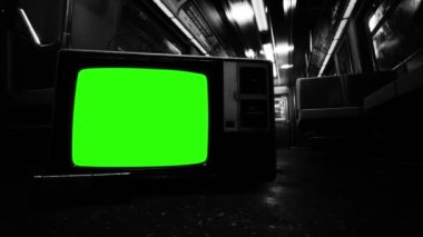 Vintage Television Set Turning Off Green Screen inside an Empty Underground Subway Carriage. Black and White Tone. 4K Resolution.