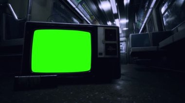 Metro Train Interior with an Old Television Set Turning Off Green Screen. Blue Tone. You can replace green screen with the footage or picture you want. You can do it with Keying effect in After Effects or any other video editing software. 4K.