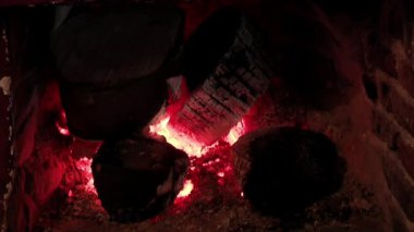 Burning Fireplace Inside a House in Winter. Close Up.  