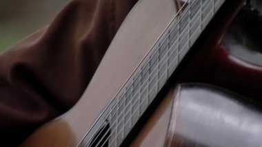 An Argentine Gaucho Playing Classical Guitar. Close Up. 