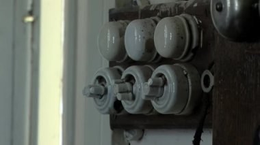 Elderly Woman turning on Old Light Switch. Close Up.