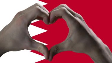 Hands showing Heart Sign on Bahrain Flag.  