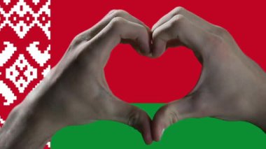Hands showing Heart Sign and the Belarus Flag.  