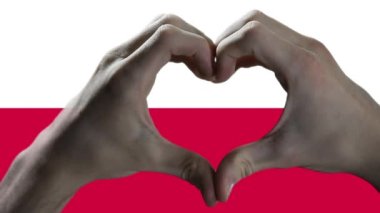 Hands showing Heart Sign over Poland Flag. 
