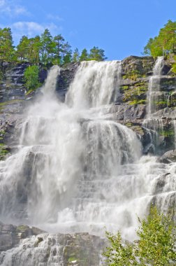 Powerful upper falls of the Tvindefossen clipart