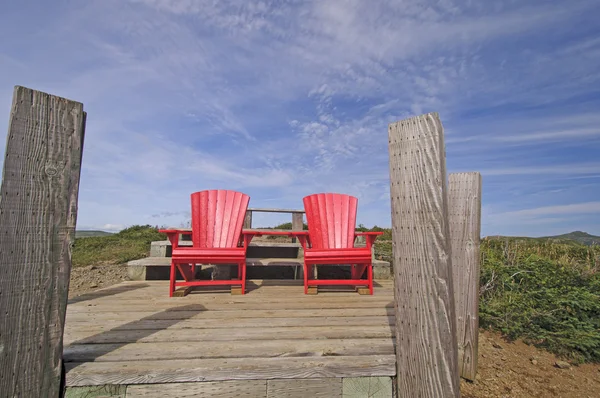 red chairs on a mountain top lookout
