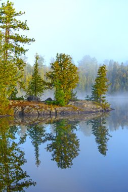 Morning Reflections on a Wildereness Lake clipart