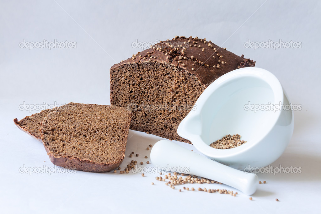 traditional Russian black bread with coriander seeds with mortar