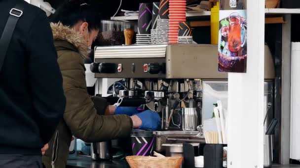 Coffee to go. Street coffee shop in equipped car. Barista girl prepares espresso — стоковое видео