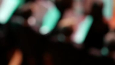 Unrecognizable singers in choir men and women hold musical notation in hands