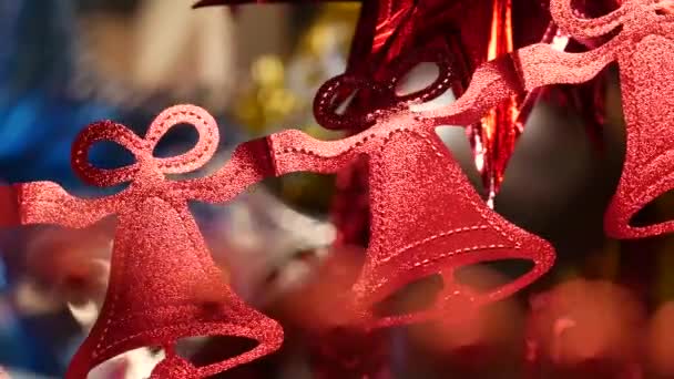 Garland of bright flat shiny paper or plastic red bells. New Year or Christmas — Vídeo de Stock