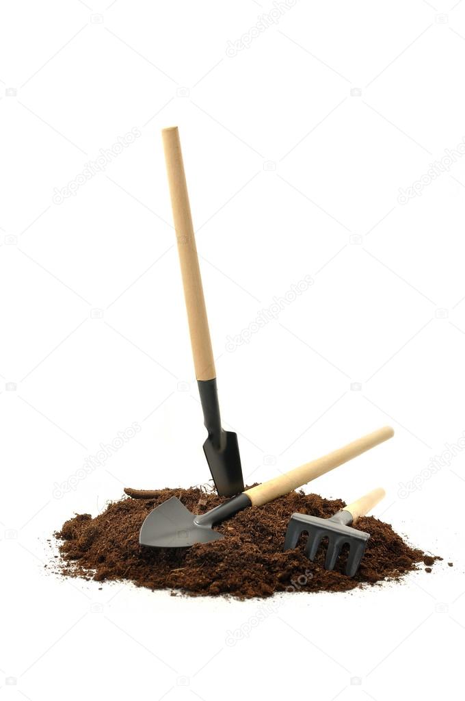gardening tools and peat on a white background