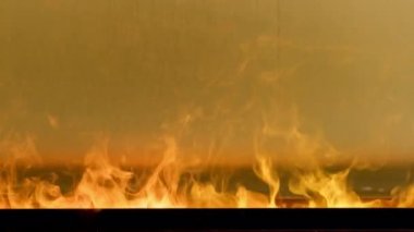Close-up artificial electric fireplace burning with smoke fire. Bio fireplace burn. Modern smart ecological alternative technologies Interior design of house inside. Electric modern fireplace.