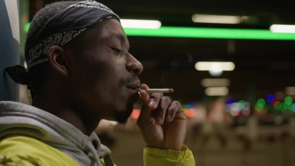 African American Man Smokes Cigarette Inhaling Harmful Smoke Nicotine While — ストック動画