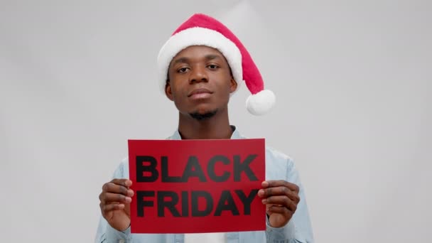 African American Young Man Santa Hat Shows Black Friday Plate — Wideo stockowe