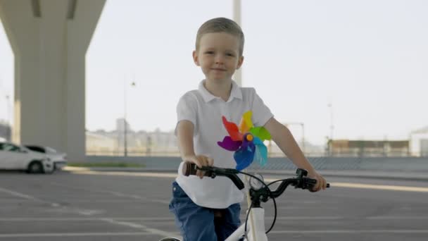 Slow Motion Portrait Kid Bike Serious Child Sits White Bicycle — Vídeos de Stock