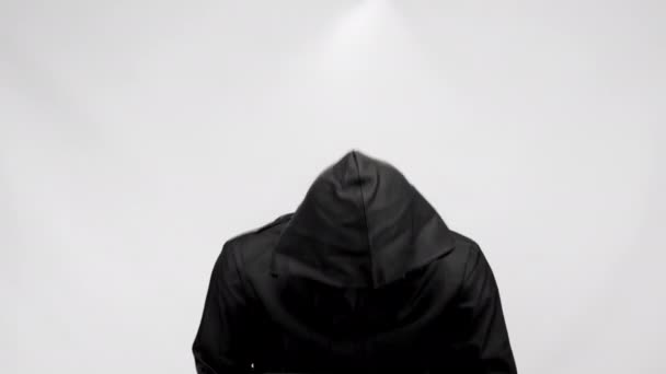 Anonymous Person Steward Mask Black Suit Hood Stands White Studio — 图库视频影像