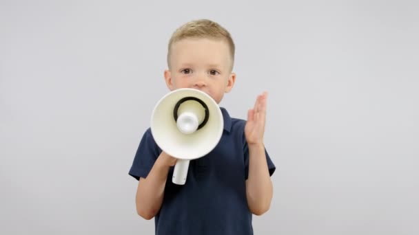 Happy Preschooler Boy Holds Yells White Megaphone Blond Child Wearing — стоковое видео
