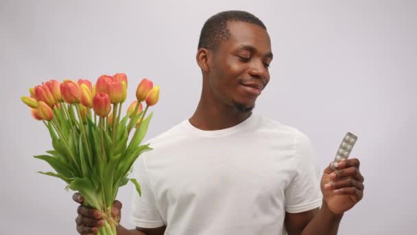 Black Man Wearing Shirt Smells Bright Flowers Looking Pills Young — Wideo stockowe