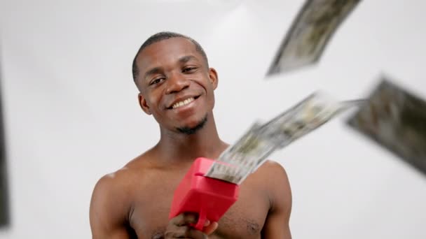 African American Man Shoots Dollars Plastic Gun Smiling White Background — Stockvideo