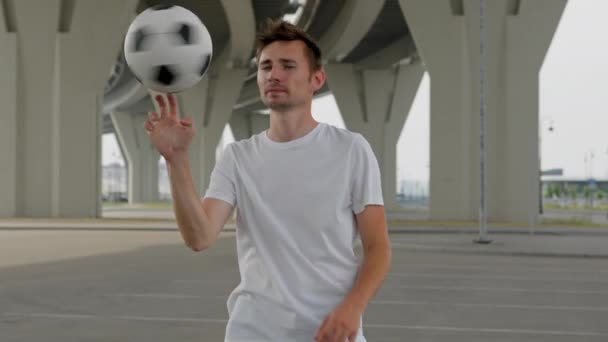 Young Man Professional Soccer Player Spinning Ball His Finger Looking — Stockvideo