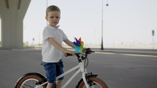 Child Boy Bike Standing Bridge Asphalt City Summer Warm Day — Stockvideo