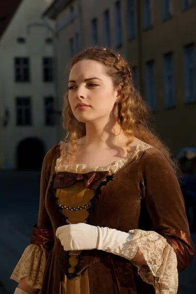 Medieval style girl at the street of tallinn — Stock Photo, Image