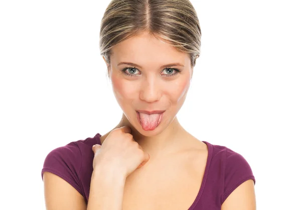 Cute woman pokes out her tongue — Stock Photo, Image