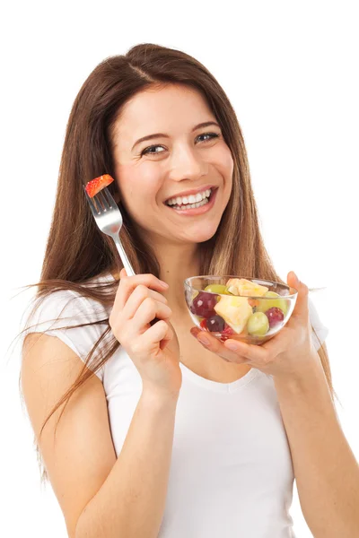 Mujer alegre comiendo frutas — Foto de Stock