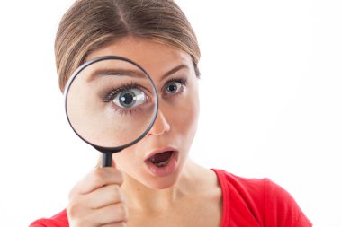 Young woman with a magnifying glass clipart