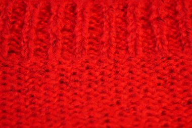 Örgü yün kumaşın ayrıntıları. Tekstil arka planı. Yünlü doku arka planı, örgü yün kumaş, tüylü yumuşacık tekstil. Yakın çekim.
