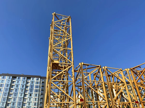 construction tower at a construction site on blue sky background. Industry new building business. Outdoors