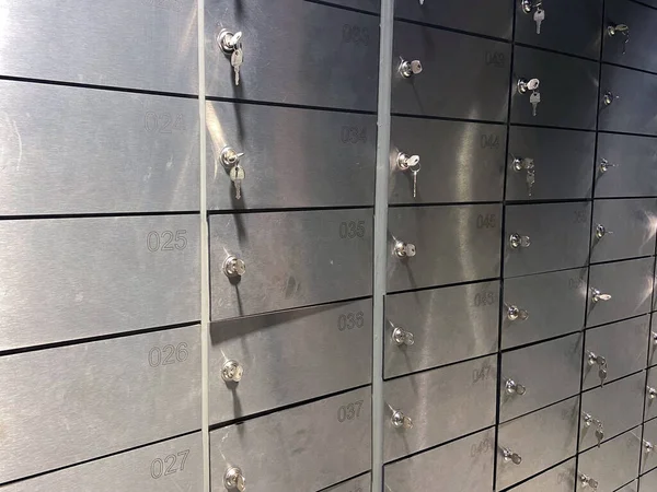 Safe bank with key, Safe deposit boxes room inside of a bank vault, closeup