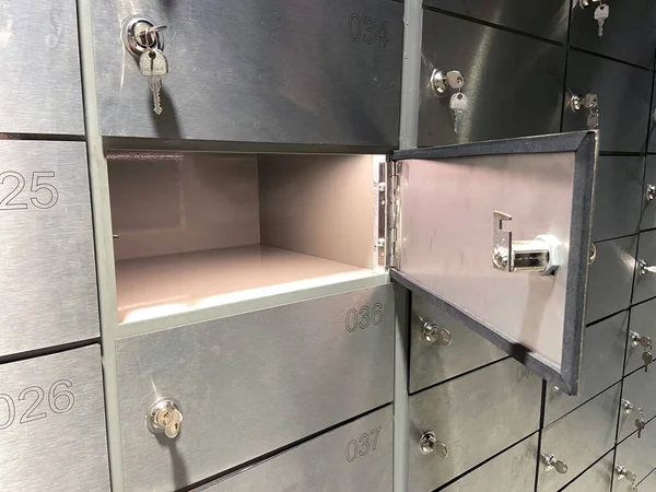 Safe bank with key, Safe deposit boxes room inside of a bank vault, closeup
