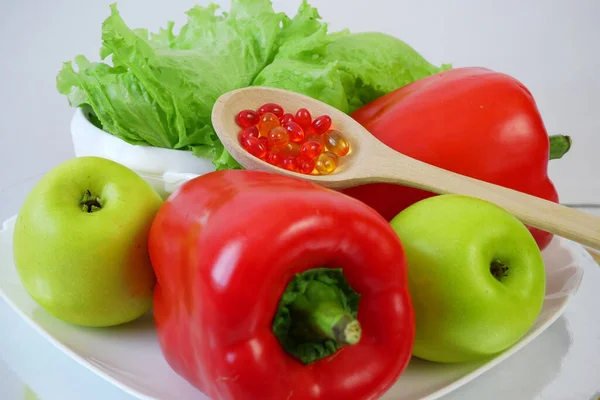 healthy food (vegetables, fruits) vs pills, natural treatment and vitamins concept