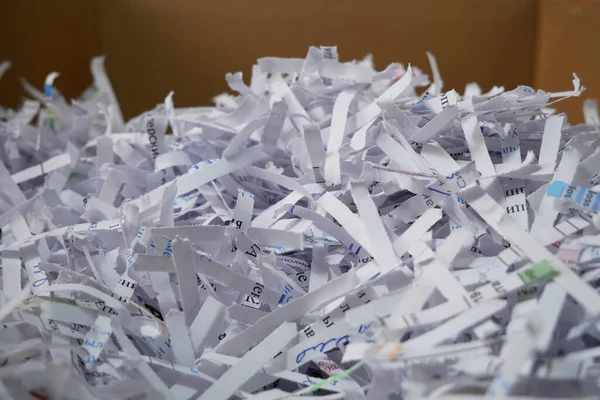 Heap of white shredded papers background, closeup