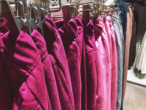 Clothes On a Rack, Stylish clothes on hangers, Clothing store, autumn and winter collection, closeup