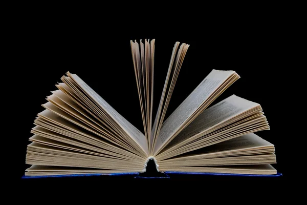 Open book on a black background — Stock Photo, Image