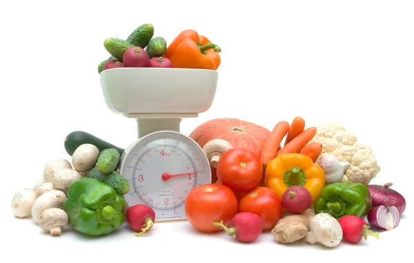Vegetables and kitchen scales isolated on white background — Stock Photo, Image