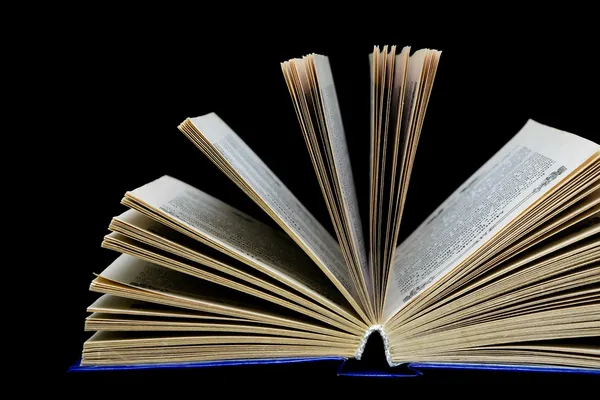 Book on a black background - close-up — Stock Photo, Image